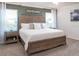 Spacious main bedroom with large bed and stylish nightstands at 555 Silver Course Run, Ocala, FL 34472