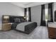 Main bedroom with plush bed and nightstands at 557 Silver Course Run, Ocala, FL 34472
