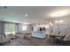 Open living space with kitchen, dining area, and hardwood floors at 557 Silver Course Run, Ocala, FL 34472