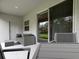 Relaxing patio with outdoor furniture at 557 Silver Course Run, Ocala, FL 34472