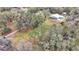 Large lot with a house and surrounding trees at 5576 Albert Williams Rd, Mulberry, FL 33860