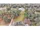 Large lot with a house and surrounding trees at 5576 Albert Williams Rd, Mulberry, FL 33860