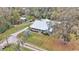 Single-story home with a metal roof and large yard at 5576 Albert Williams Rd, Mulberry, FL 33860