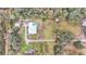 Aerial view showing house, pool, detached garage and yard at 5576 Albert Williams Rd, Mulberry, FL 33860
