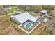 Aerial view of house, pool, boat storage, and expansive yard at 5576 Albert Williams Rd, Mulberry, FL 33860