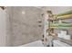 Neat bathroom with shower/tub combo and shelving at 5576 Albert Williams Rd, Mulberry, FL 33860