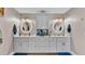 Bathroom with double vanity and grey cabinets at 5576 Albert Williams Rd, Mulberry, FL 33860