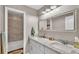 Clean bathroom with double vanity and marble countertop at 5576 Albert Williams Rd, Mulberry, FL 33860