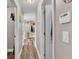 Bathroom hallway with doors to two bathrooms and a shower at 5576 Albert Williams Rd, Mulberry, FL 33860
