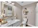 Elegant bathroom with marble countertop, and modern fixtures at 5576 Albert Williams Rd, Mulberry, FL 33860