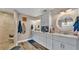 Elegant bathroom with dual vanity, large mirror, and shower at 5576 Albert Williams Rd, Mulberry, FL 33860