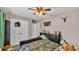 Bright bedroom with ceiling fan and double doors at 5576 Albert Williams Rd, Mulberry, FL 33860