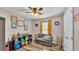Bright bedroom with wood floors, couch, and built-in storage at 5576 Albert Williams Rd, Mulberry, FL 33860