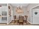 Charming dining area with a checkered tablecloth and wooden chairs at 5576 Albert Williams Rd, Mulberry, FL 33860