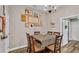 Charming dining area with a checkered tablecloth and wooden chairs at 5576 Albert Williams Rd, Mulberry, FL 33860