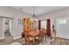 Charming dining room with hardwood floors, a rustic table, and a wooden hutch at 5576 Albert Williams Rd, Mulberry, FL 33860