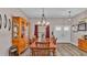 Bright dining room features a wooden table with chairs and a built-in hutch at 5576 Albert Williams Rd, Mulberry, FL 33860