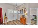 Bright entryway with double doors, wood console table and Gathering photos at 5576 Albert Williams Rd, Mulberry, FL 33860