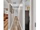 Bright hallway with wood-look floors and wall decor at 5576 Albert Williams Rd, Mulberry, FL 33860