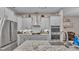 Modern kitchen with stainless steel appliances and marble countertops at 5576 Albert Williams Rd, Mulberry, FL 33860
