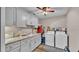 Laundry room with washer, dryer, and ample counter space at 5576 Albert Williams Rd, Mulberry, FL 33860