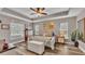 Spacious main bedroom with ceiling fan, large bed, and ample closet space at 5576 Albert Williams Rd, Mulberry, FL 33860