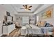 Main bedroom with large bed, dresser, and ocean-themed decor at 5576 Albert Williams Rd, Mulberry, FL 33860