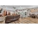 Open floor plan showing kitchen, living room, and dining area with luxury vinyl plank flooring at 5576 Albert Williams Rd, Mulberry, FL 33860