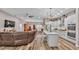 Open floor plan showing kitchen, living room, and dining area with luxury vinyl plank flooring at 5576 Albert Williams Rd, Mulberry, FL 33860