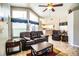 Bright living room with leather furniture and view into dining area at 563 Emerald Cove Loop, Lakeland, FL 33813