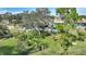 Spacious backyard with a pool, lush landscaping and fire pit at 6004 Greenleaf Cir, Winter Haven, FL 33884