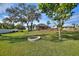 Spacious backyard with fire pit and landscaping at 6004 Greenleaf Cir, Winter Haven, FL 33884