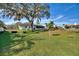 Large backyard with grassy area and fire pit at 6004 Greenleaf Cir, Winter Haven, FL 33884