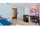 Small bedroom with a daybed, desk, and closet at 6004 Greenleaf Cir, Winter Haven, FL 33884