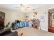Spacious bedroom with a bed, seating, and built-in shelving at 6004 Greenleaf Cir, Winter Haven, FL 33884