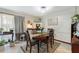 Bright dining room with wooden table and comfortable chairs at 6004 Greenleaf Cir, Winter Haven, FL 33884