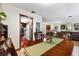 Warm dining room with a view into the kitchen area at 6004 Greenleaf Cir, Winter Haven, FL 33884
