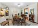 Charming dining area featuring a wooden table and kitchen view at 6004 Greenleaf Cir, Winter Haven, FL 33884