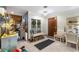 Light and airy entryway with bench seating and wooden door at 6004 Greenleaf Cir, Winter Haven, FL 33884