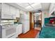 Bright kitchen with white cabinets, green countertops, and modern appliances at 6004 Greenleaf Cir, Winter Haven, FL 33884