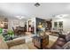 Spacious living room featuring a leather couch and wood coffee table at 6004 Greenleaf Cir, Winter Haven, FL 33884