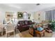 Comfortable living room with leather sofa and charming decor at 6004 Greenleaf Cir, Winter Haven, FL 33884