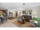 Open living area showcasing a brown leather sofa and entryway at 6004 Greenleaf Cir, Winter Haven, FL 33884