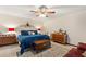 Main bedroom with a king-size bed and ceiling fan at 6004 Greenleaf Cir, Winter Haven, FL 33884