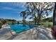 Relaxing pool area with a scenic lake view at 6004 Greenleaf Cir, Winter Haven, FL 33884