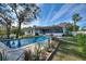 Relaxing pool area with lush landscaping at 6004 Greenleaf Cir, Winter Haven, FL 33884