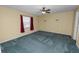 Bright bedroom with ceiling fan and carpet at 7101 Scenic Pl, Lakeland, FL 33810
