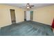 Spacious bedroom with ceiling fan and carpet at 7101 Scenic Pl, Lakeland, FL 33810
