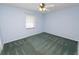 Bedroom with ceiling fan and carpet at 7101 Scenic Pl, Lakeland, FL 33810