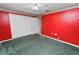 Red bedroom with green carpet and double door closet at 7101 Scenic Pl, Lakeland, FL 33810